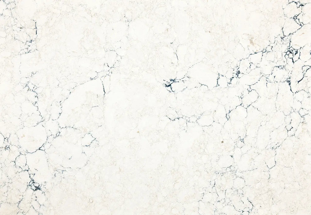 Travella quartz surface with cream base and dark blue veining — custom countertops fabricated and installed by Signature Stone LV