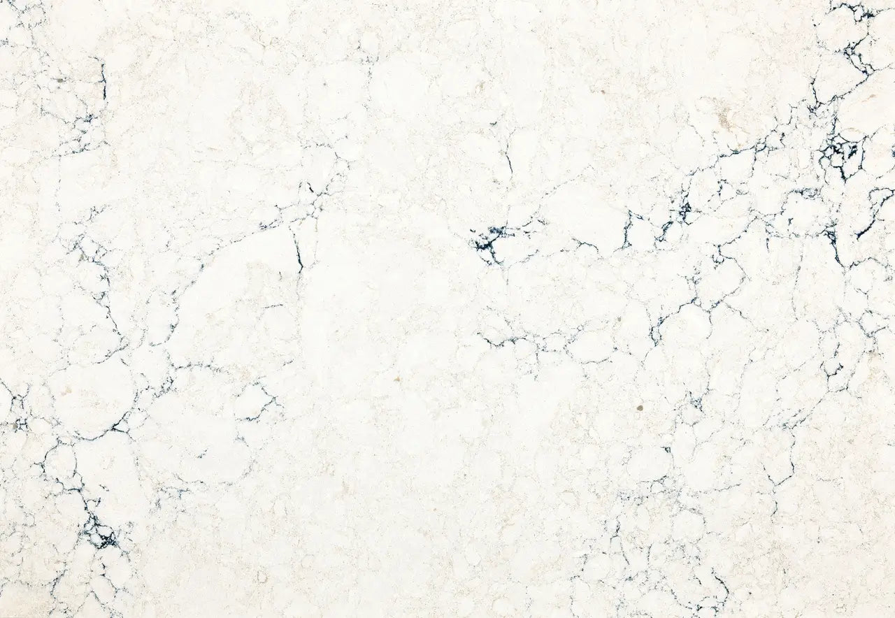 Travella quartz surface with cream base and dark blue veining — custom countertops fabricated and installed by Signature Stone LV