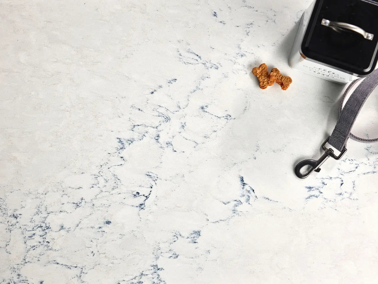 Travella quartz surface with white base and blue veining patterns — custom countertops fabricated and installed by Signature Stone LV