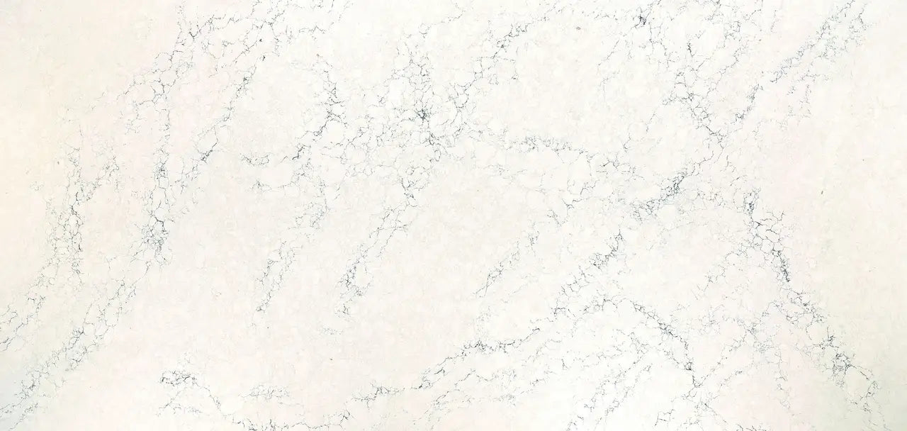 Quartz surface with cream and beige veining and subtle gray accents — premium countertop fabrication by Signature Stone Las Vegas