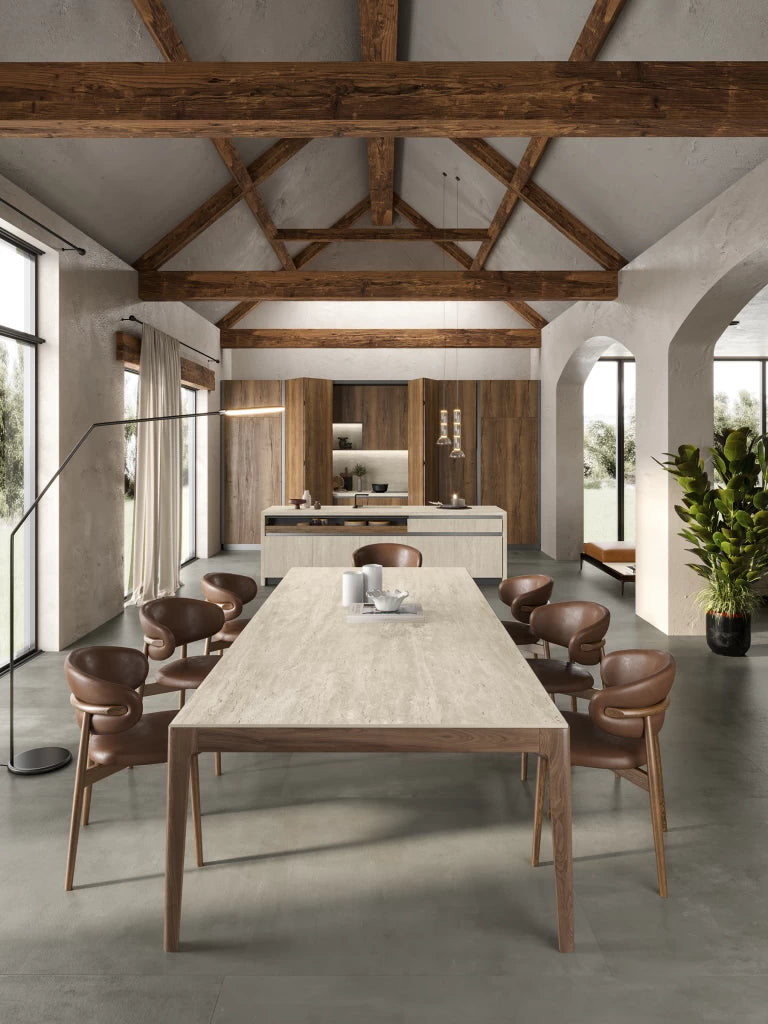 Travertino Pearl kitchen island and dining table with light beige finish in modern rustic space — expert countertop fabrication by Signature Stone Las Vegas