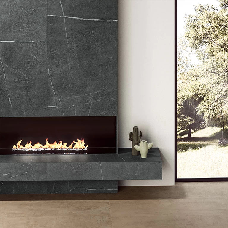 Soapstone dark fireplace surround with veined pattern and matte finish — elegant stone countertops installed by Signature Stone Las Vegas