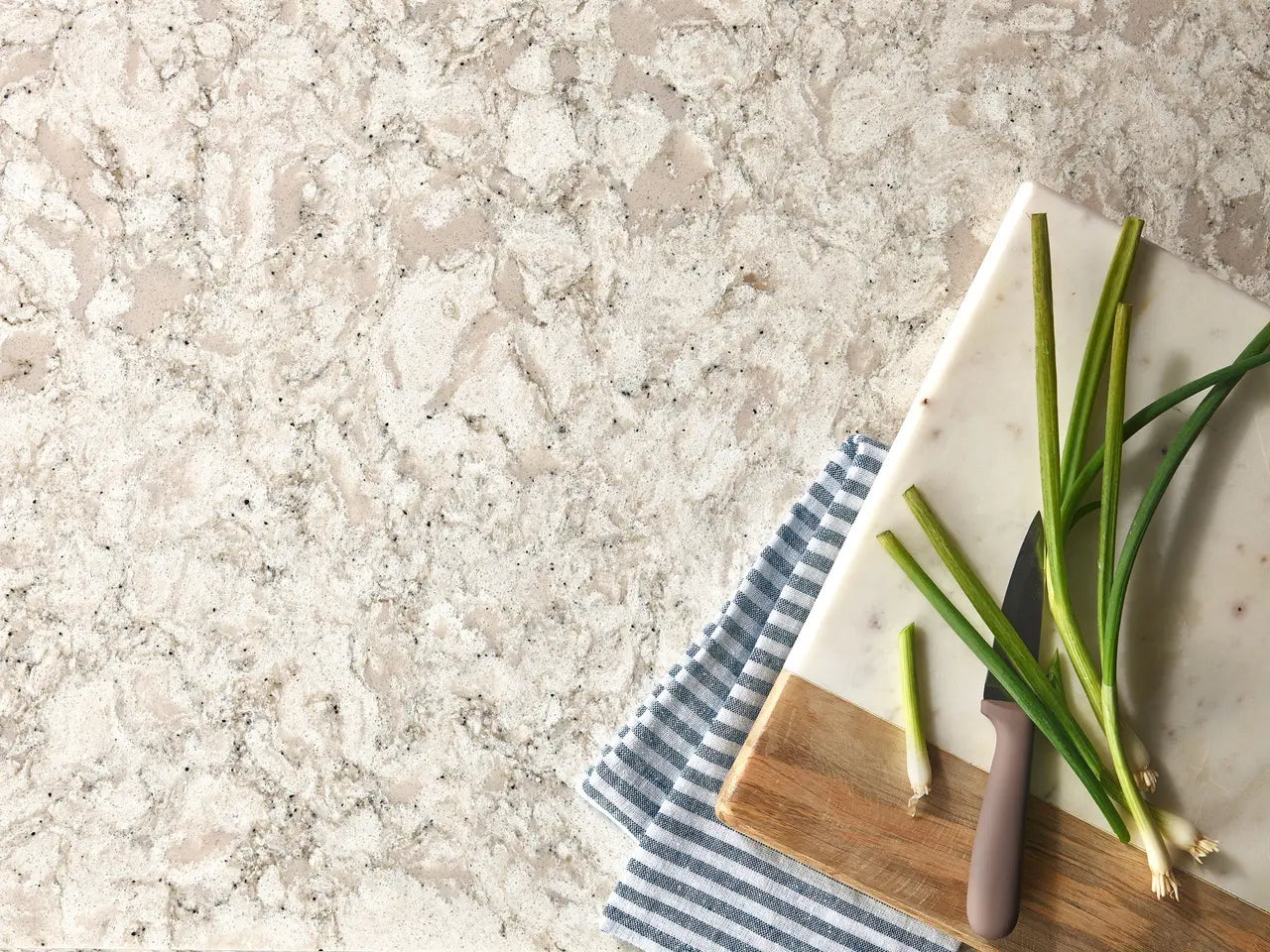 Warwick quartz surface with elegant white and gray veining and polished finish — custom countertops fabricated and installed by Signature Stone LV