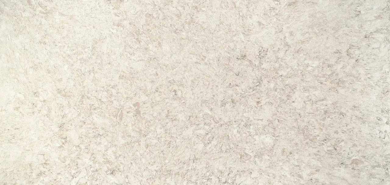 Quartz slab surface with cream and beige speckled pattern and smooth polished finish — premium countertop fabrication by Signature Stone Las Vegas