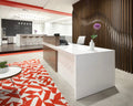 White Cliff quartz reception desk with clean white finish and modern edge detail — premium stone countertops installed by Signature Stone Las Vegas