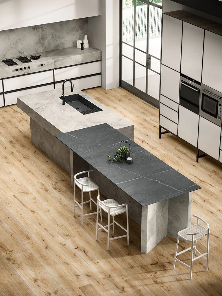 White Cloud quartz kitchen island and perimeter countertops with honed finish and waterfall edge — elegant stone countertops installed by Signature Stone Las...