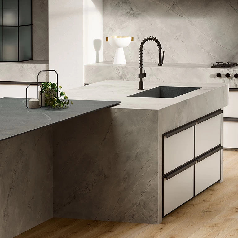 White Cloud quartz kitchen island with integrated sink and sleek white finish — premium stone countertops installed by Signature Stone Las Vegas