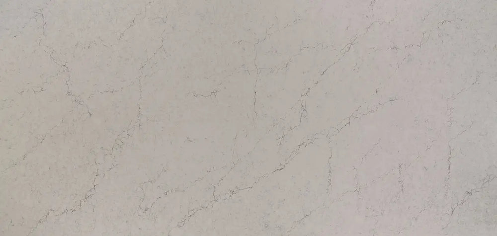 Quartz slab with soft beige tones and delicate veining pattern — premium stone countertops installed by Signature Stone Las Vegas