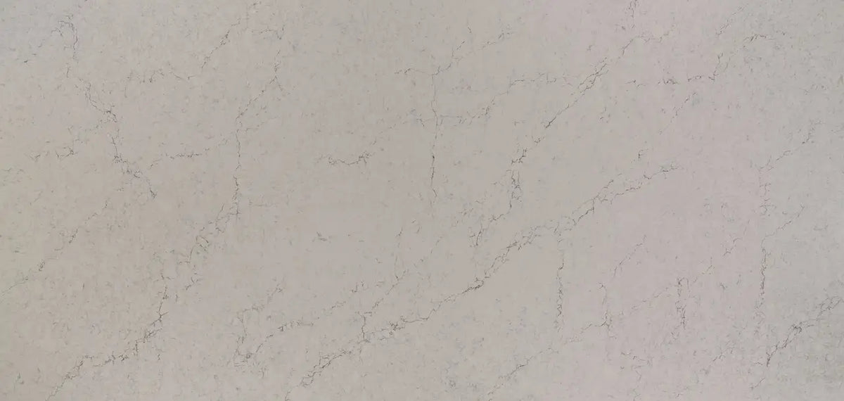Quartz slab with soft beige tones and delicate veining pattern — premium stone countertops installed by Signature Stone Las Vegas