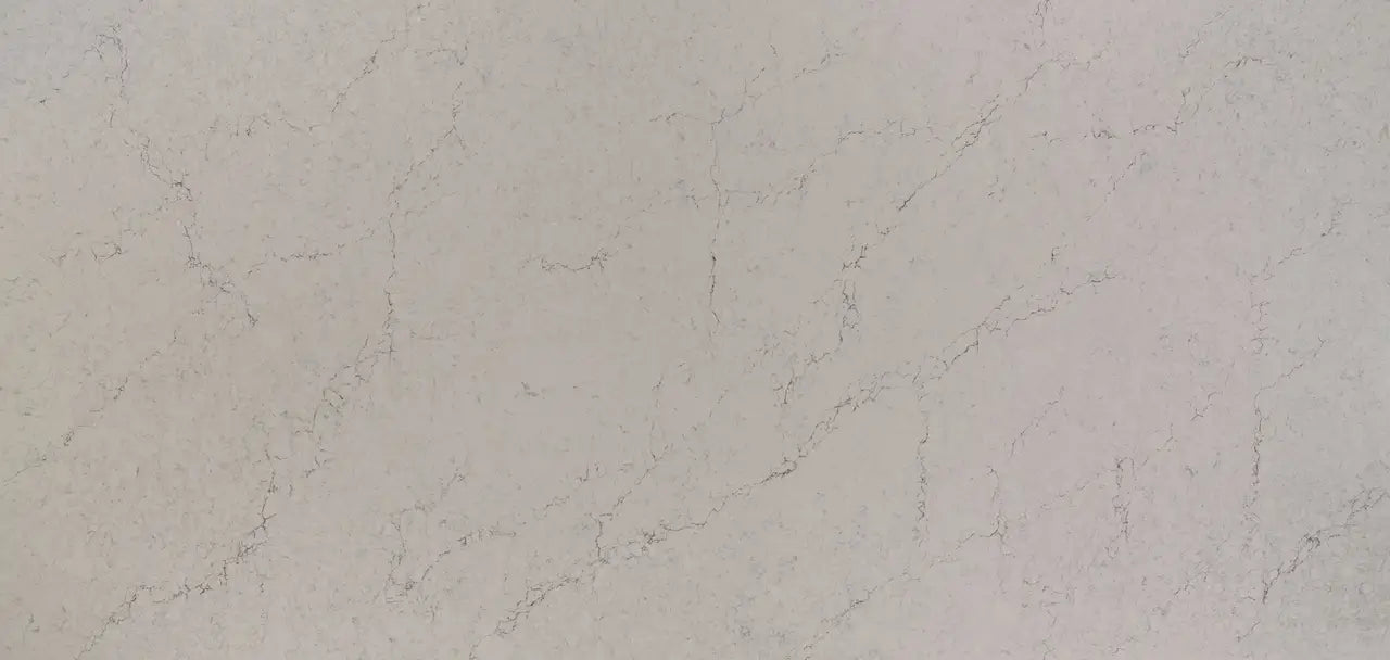Quartz slab with soft beige tones and delicate veining pattern — premium stone countertops installed by Signature Stone Las Vegas