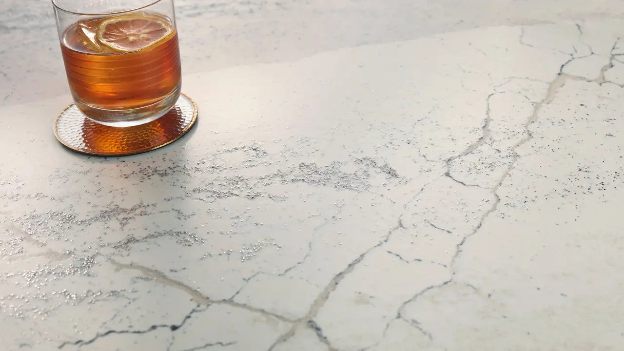 Windsor Steel Satin Ridge quartz surface with textured white marble-look veining and matte finish — custom countertops fabricated and installed by Signature ...